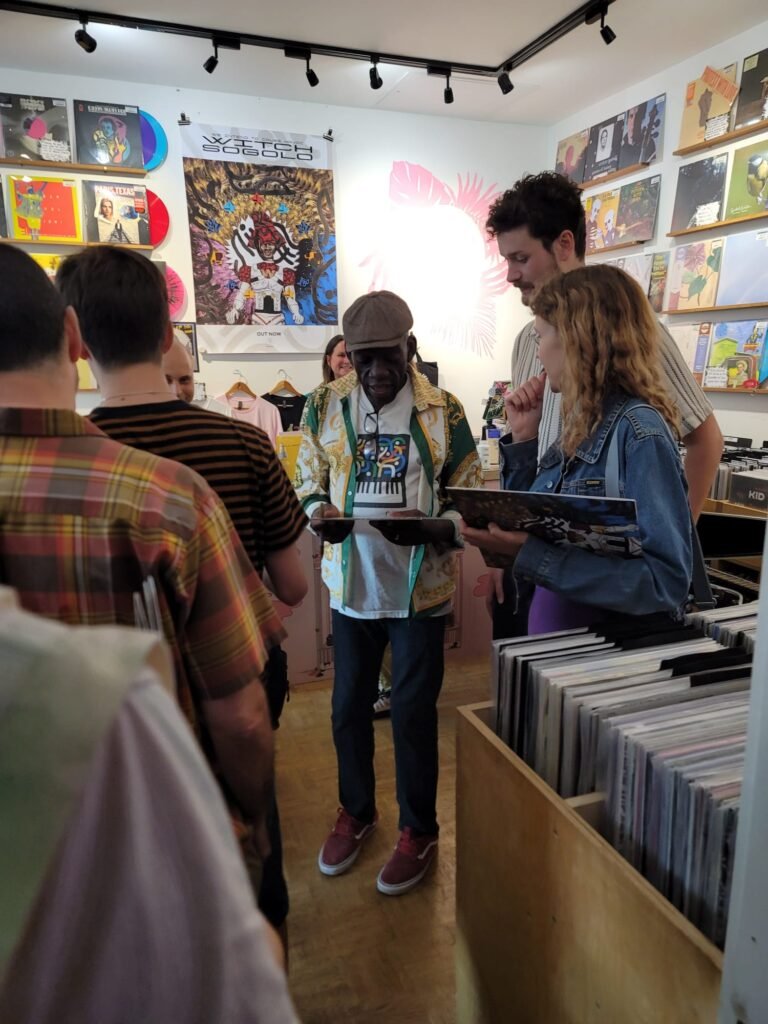 Patrick signing albums